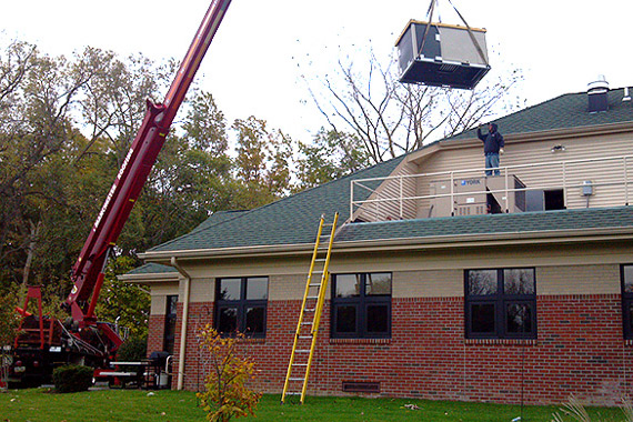 Northwest Services team installing commercial HVAC unit